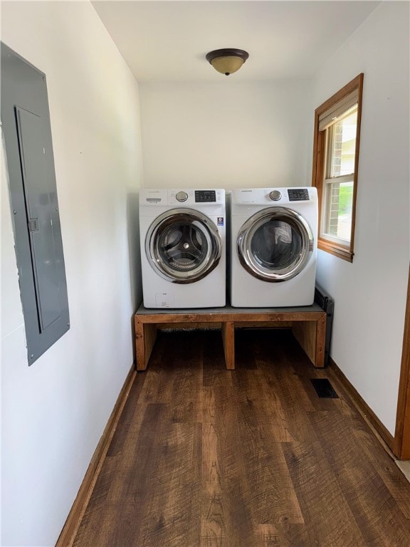 5265 Slater Rd, Anderson, SC 29621 - washroom with electric panel, washer and clothes dryer, baseboards, and wood finished floors