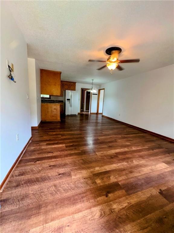 5265 Slater Rd, Anderson, SC 29621 - unfurnished living room with ceiling fan, dark wood-style flooring, and baseboards