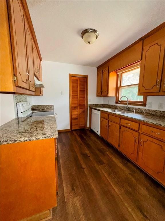 5265 Slater Rd, Anderson, SC 29621 - kitchen featuring white appliances, dark wood-style floors, brown cabinets, and a sink