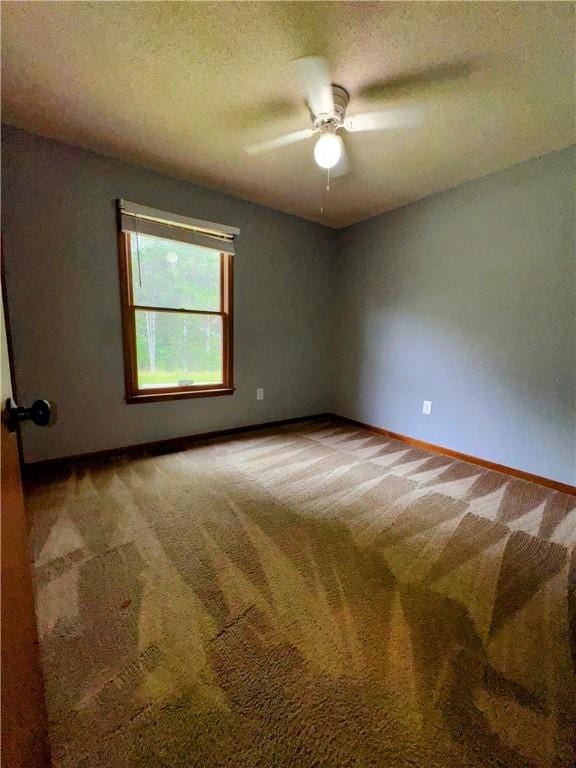 5265 Slater Rd, Anderson, SC 29621 - spare room with carpet flooring, ceiling fan, baseboards, and a textured ceiling