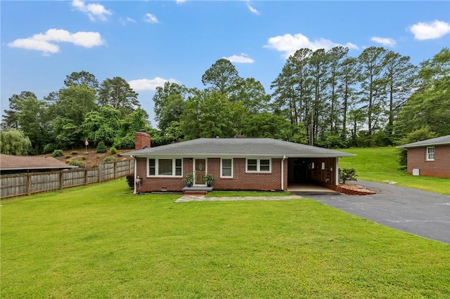304 Mountain View Dr, Seneca, SC 29672 - view of front of property with a chimney, driveway, brick siding, view of wooded area, and a carport