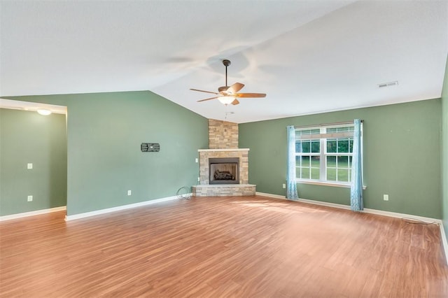 123 Stevens Ct, Williamston, SC 29697 - unfurnished living room featuring a ceiling fan, lofted ceiling, a fireplace, wood finished floors, and baseboards
