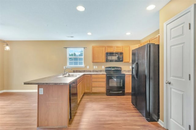 123 Stevens Ct, Williamston, SC 29697 - kitchen featuring black appliances, a sink, a peninsula, light brown cabinetry, and recessed lighting