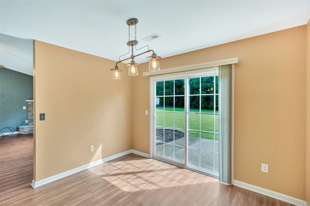 123 Stevens Ct, Williamston, SC 29697 - unfurnished dining area featuring light wood-style flooring and baseboards