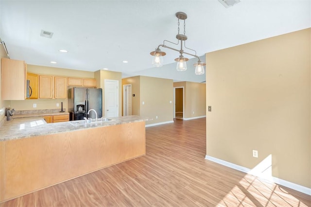 123 Stevens Ct, Williamston, SC 29697 - kitchen with stainless steel appliances, light brown cabinets, a peninsula, baseboards, and recessed lighting