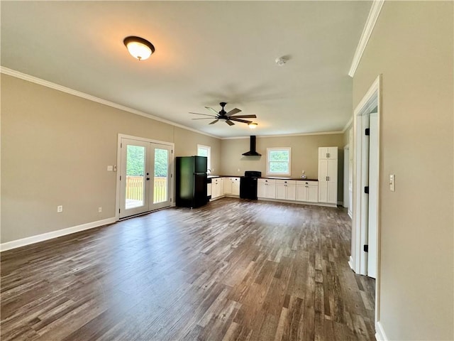 800 Holiday Dam Rd, Honea Path, SC 29654 - unfurnished living room featuring dark wood-type flooring, ceiling fan, ornamental molding, healthy amount of natural light, and french doors