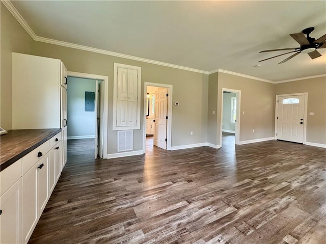 800 Holiday Dam Rd, Honea Path, SC 29654 - unfurnished living room featuring dark wood-style floors, crown molding, a ceiling fan, and baseboards