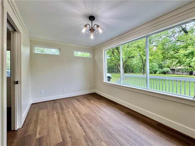 800 Holiday Dam Rd, Honea Path, SC 29654 - empty room featuring baseboards, dark wood-type flooring, a chandelier, and ornamental molding
