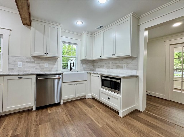 800 Holiday Dam Rd, Honea Path, SC 29654 - kitchen featuring appliances with stainless steel finishes, a sink, light wood-type flooring, plenty of natural light, and ornamental molding