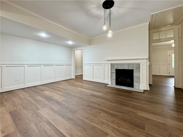 800 Holiday Dam Rd, Honea Path, SC 29654 - unfurnished living room with a decorative wall, crown molding, wood finished floors, a fireplace, and a wainscoted wall
