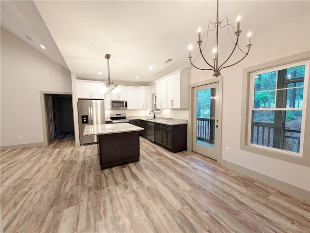 40 Pine Garden Way Dr, Salem, SC 29676 - kitchen featuring appliances with stainless steel finishes, a sink, a chandelier, a center island, and vaulted ceiling