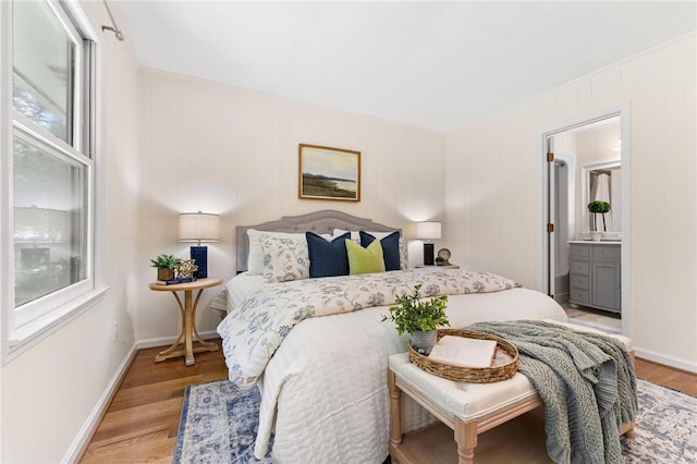 131 Shoreside Dr, Martin, GA 30557 - bedroom featuring light wood-type flooring, baseboards, and connected bathroom