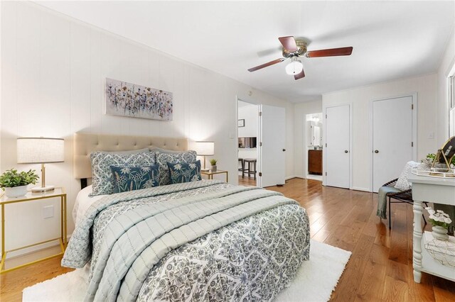 131 Shoreside Dr, Martin, GA 30557 - bedroom with hardwood / wood-style flooring, a ceiling fan, and two closets