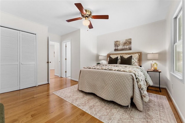 131 Shoreside Dr, Martin, GA 30557 - bedroom with wood finished floors, multiple windows, baseboards, and a ceiling fan