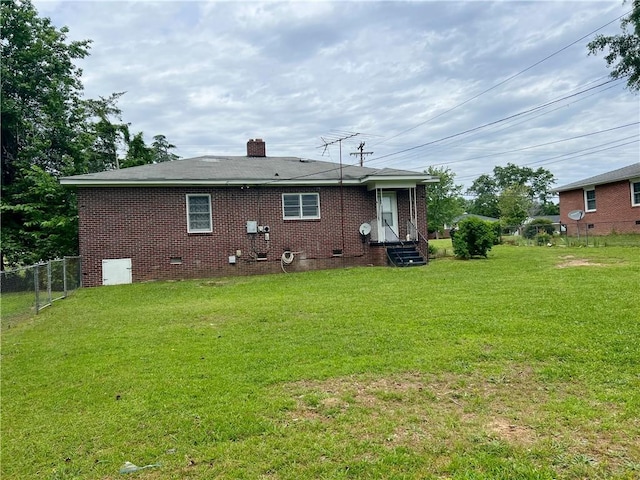 701 W Greer St, Honea Path, SC 29654 - back of property with crawl space, entry steps, a chimney, and brick siding