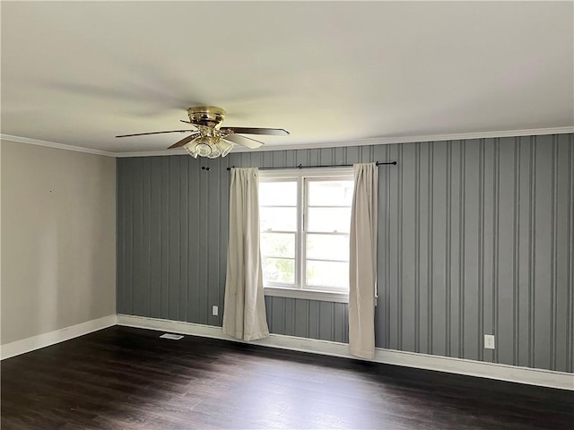 701 W Greer St, Honea Path, SC 29654 - spare room featuring baseboards, dark wood finished floors, ceiling fan, and crown molding