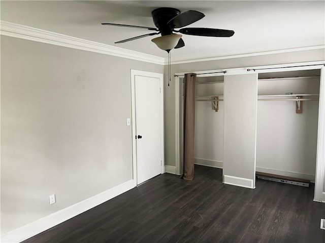 701 W Greer St, Honea Path, SC 29654 - unfurnished bedroom featuring dark wood finished floors, baseboards, crown molding, a ceiling fan, and a closet
