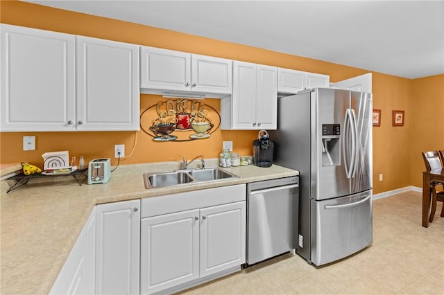 1014 Stoneham Cir, Anderson, SC 29626 - kitchen featuring appliances with stainless steel finishes, a sink, light countertops, and white cabinets