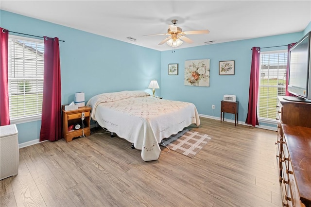 1014 Stoneham Cir, Anderson, SC 29626 - bedroom with light wood-style floors, baseboards, multiple windows, and a ceiling fan