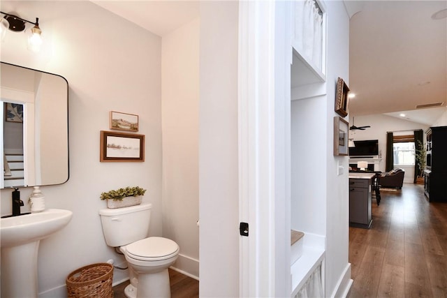 317 Encampment Blvd, Simpsonville, SC 29681 - bathroom featuring toilet, wood finished floors, baseboards, and vaulted ceiling