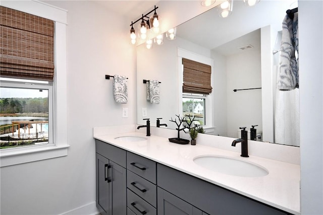317 Encampment Blvd, Simpsonville, SC 29681 - bathroom featuring double vanity and baseboards