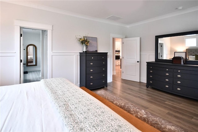 317 Encampment Blvd, Simpsonville, SC 29681 - bedroom featuring dark wood-style flooring, crown molding, a wainscoted wall, and a decorative wall
