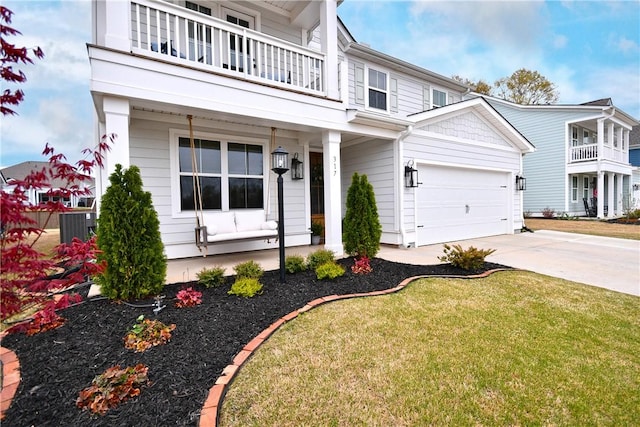 317 Encampment Blvd, Simpsonville, SC 29681 - view of front of property with a balcony, driveway, a garage, a front yard, and a porch