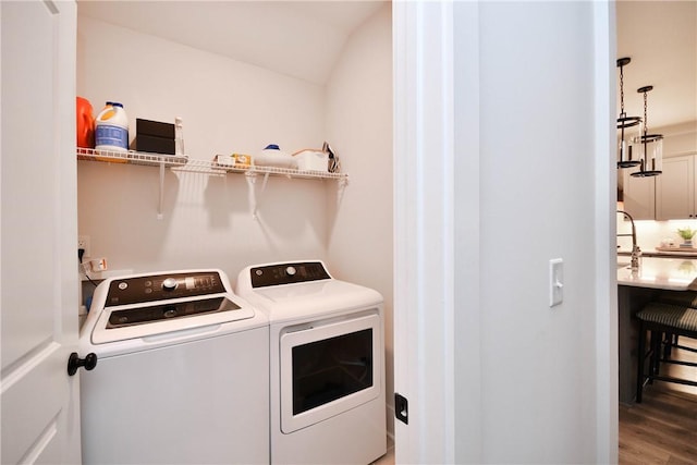 317 Encampment Blvd, Simpsonville, SC 29681 - laundry room with independent washer and dryer and wood finished floors
