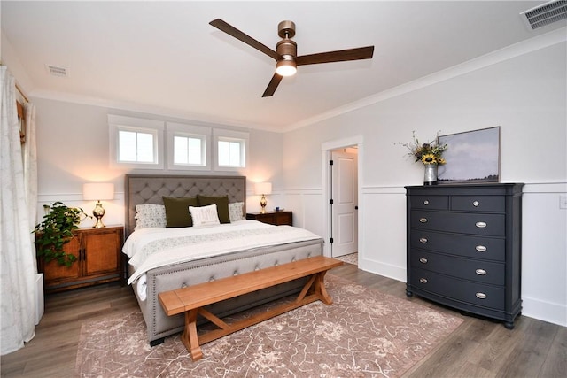 317 Encampment Blvd, Simpsonville, SC 29681 - bedroom featuring wood finished floors, ornamental molding, wainscoting, and a ceiling fan