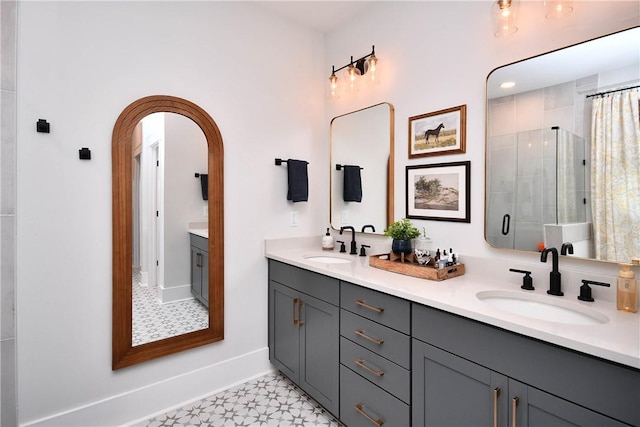 317 Encampment Blvd, Simpsonville, SC 29681 - full bath featuring double vanity, tiled shower, baseboards, and tile patterned floors