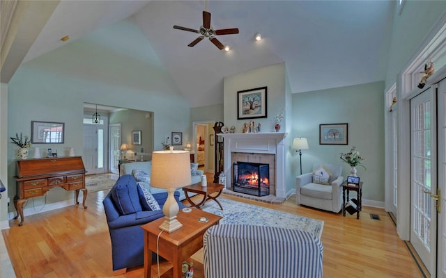 138 Grandview Ct, Hartwell, GA 30643 - living area featuring a brick fireplace, light wood-type flooring, a ceiling fan, high vaulted ceiling, and baseboards