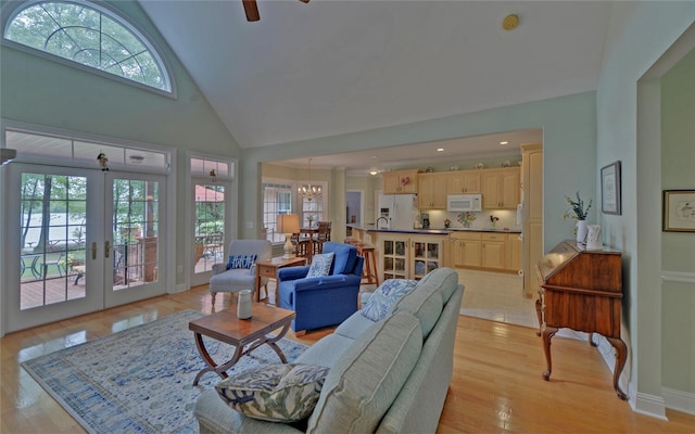 138 Grandview Ct, Hartwell, GA 30643 - living area with plenty of natural light, french doors, high vaulted ceiling, light wood-style flooring, and a chandelier