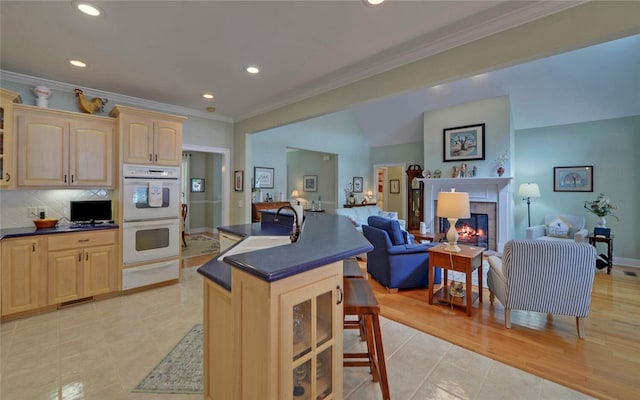 138 Grandview Ct, Hartwell, GA 30643 - kitchen featuring dark countertops, light brown cabinets, open floor plan, white double oven, and light tile patterned flooring
