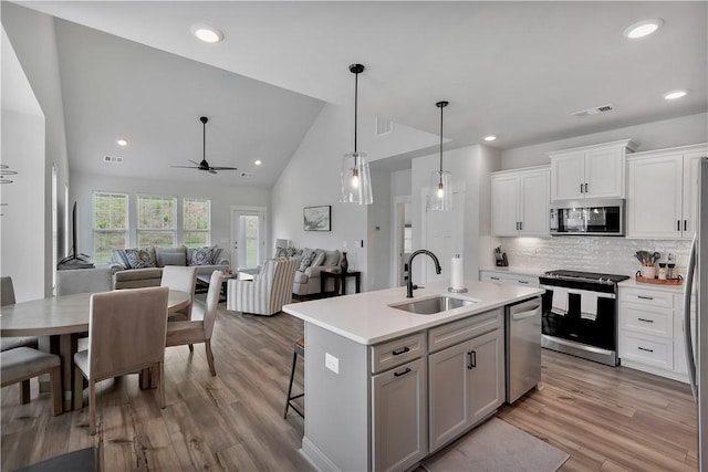 222 Grange Vally Ln, Central, SC 29630 - kitchen with stainless steel appliances, a sink, light countertops, a center island with sink, and open floor plan