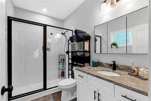 324 Sweetbriar Trl, Westminster, SC 29693 - full bath featuring vanity, toilet, a stall shower, and wood finished floors