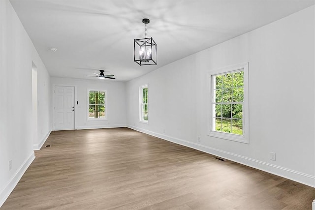 320 Fowler Rd, West Union, SC 29696 - empty room with a chandelier, baseboards, wood finished floors, and ceiling fan