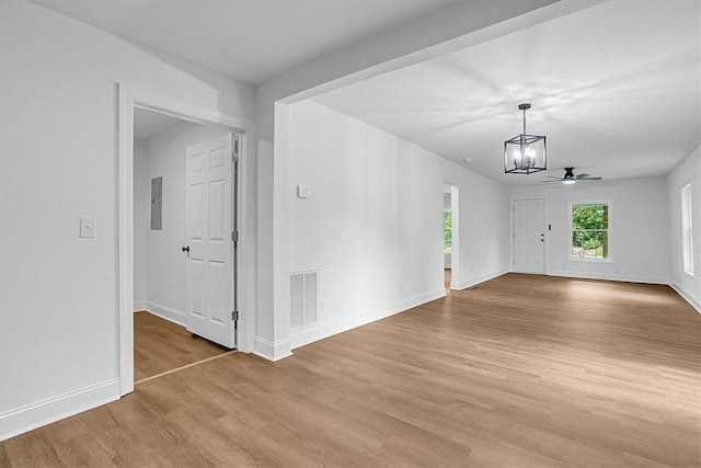 320 Fowler Rd, West Union, SC 29696 - spare room with a chandelier, electric panel, light wood-style flooring, baseboards, and ceiling fan
