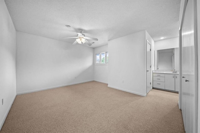 704 Loran Pointe Cir, Seneca, SC 29672 - spare room featuring light carpet, ceiling fan, a textured ceiling, and baseboards