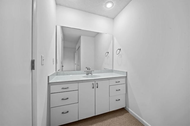 704 Loran Pointe Cir, Seneca, SC 29672 - bathroom featuring vanity, a textured ceiling, and baseboards