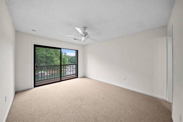 704 Loran Pointe Cir, Seneca, SC 29672 - unfurnished room with carpet floors, ceiling fan, baseboards, and a textured ceiling