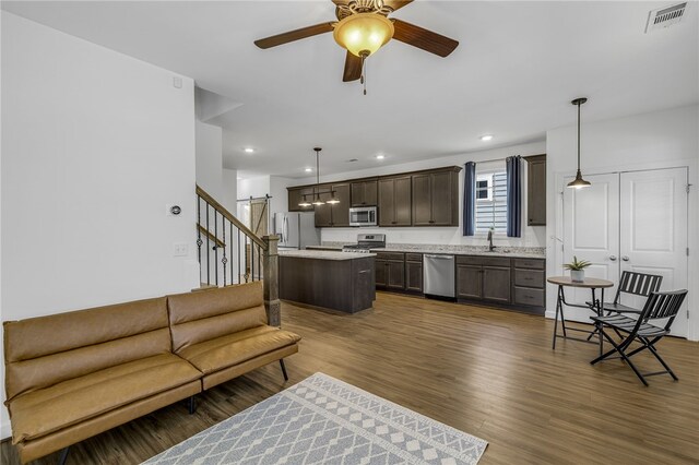 3401 Old Buncombe Rd, Greenville, SC 29617 - living room with ceiling fan, stairway, dark wood-style flooring, and recessed lighting