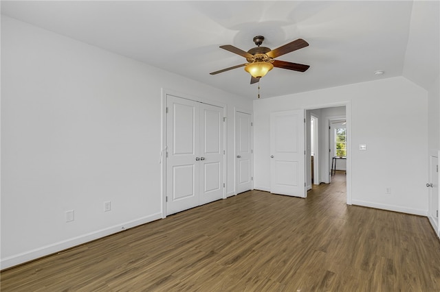 3401 Old Buncombe Rd, Greenville, SC 29617 - unfurnished bedroom with wood finished floors, baseboards, multiple closets, and ceiling fan