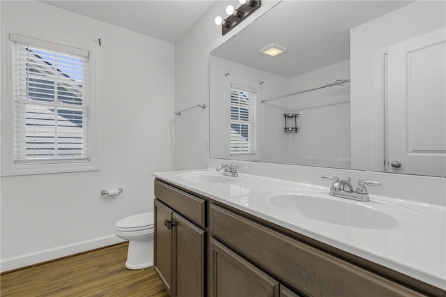 3401 Old Buncombe Rd, Greenville, SC 29617 - full bathroom with toilet, double vanity, baseboards, wood finished floors, and a shower