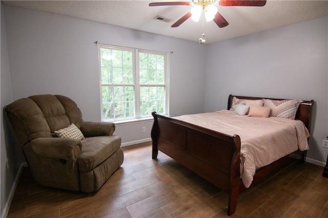 124 Grand Oak Cir, Pendleton, SC 29670 - bedroom featuring baseboards, wood finished floors, a textured ceiling, and a ceiling fan