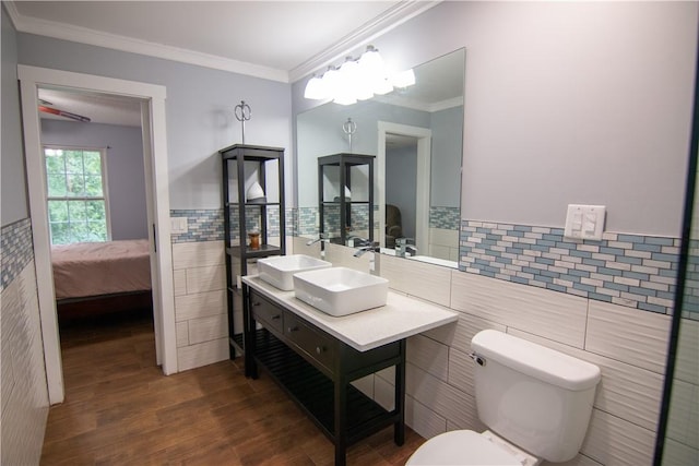 124 Grand Oak Cir, Pendleton, SC 29670 - ensuite bathroom with tile walls, double vanity, wood finished floors, toilet, and wainscoting