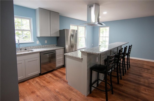 124 Grand Oak Cir, Pendleton, SC 29670 - kitchen featuring dishwasher, island range hood, a sink, gray cabinets, and wood finished floors
