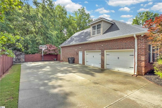 120 Red Maple Cir, Easley, SC 29642 - view of side of property featuring a shingled roof, concrete driveway, brick siding, and a garage