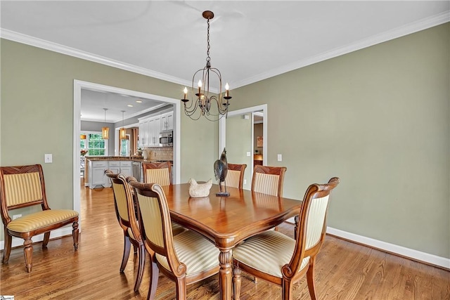 120 Red Maple Cir, Easley, SC 29642 - dining room featuring a chandelier, light wood-type flooring, ornamental molding, and baseboards