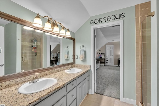 120 Red Maple Cir, Easley, SC 29642 - full bathroom featuring lofted ceiling, double vanity, a stall shower, and baseboards