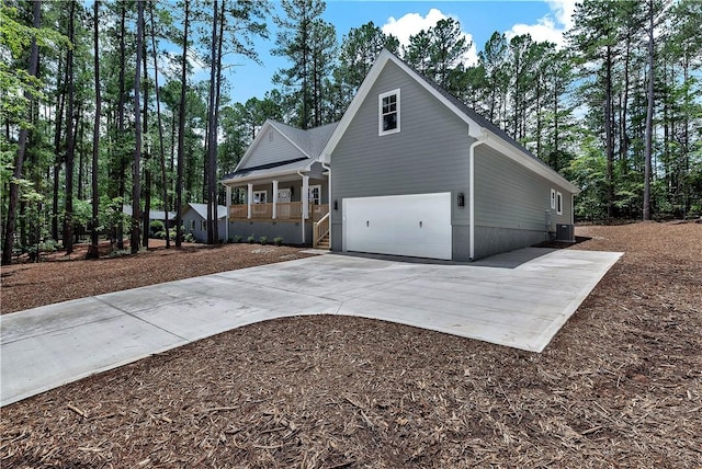 32 Pine Garden Way Dr, Salem, SC 29676 - view of side of home with a porch, cooling unit, driveway, and a garage